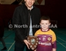 Aaron McHendry from Central Bar Ballycastle presenting Naomh Padraig 3 team captain Steven McGill with the North Antrim Central Bar Division 6 Indoor Hurling league shield
